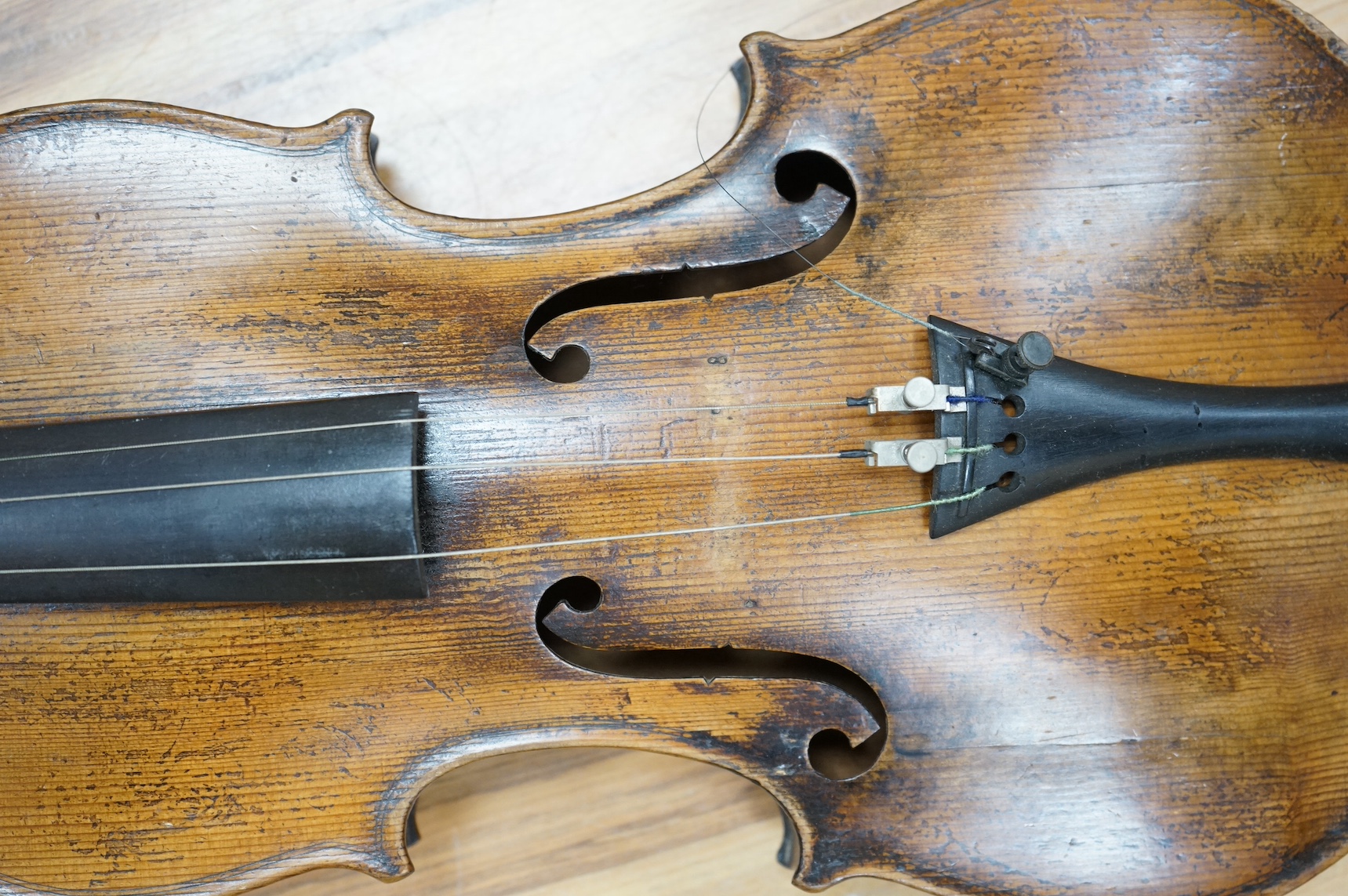 A cased 19th century French violin, back, 36cm. Condition - fair